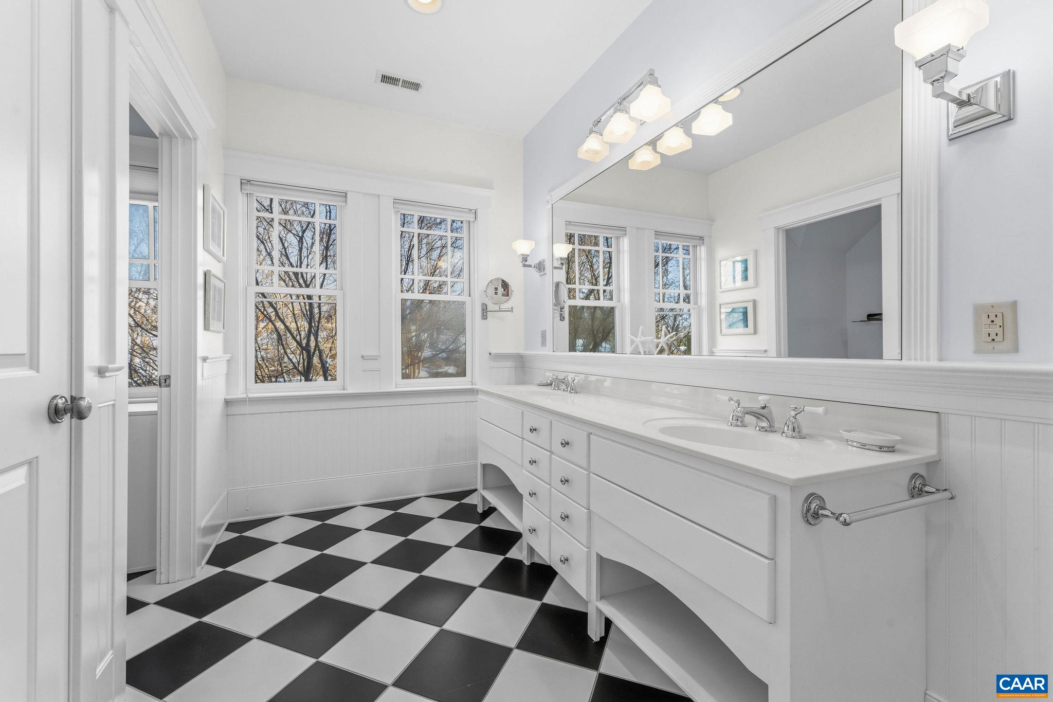 3135 Rocks Farm Court Charlottesville, VA 22903 - Photo 37 of 75 a spacious bathroom with a sink mirror and shower