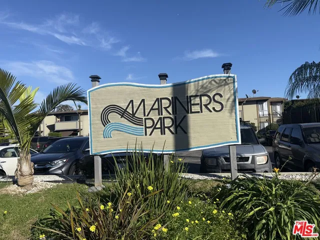 a room with a sink cabinets and a window