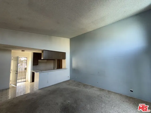 a view of a swimming pool with an outdoor seating and a garden