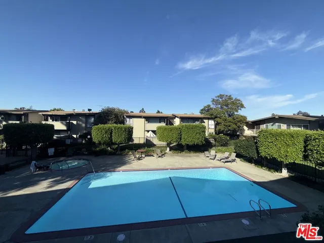 a backyard of a house with yard and outdoor seating