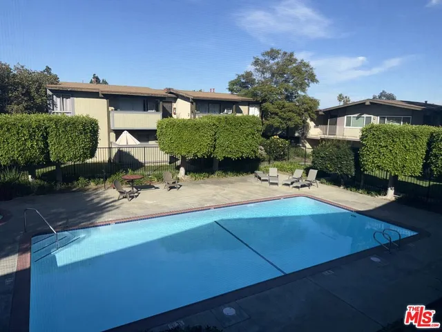 a view of a terrace with sitting area