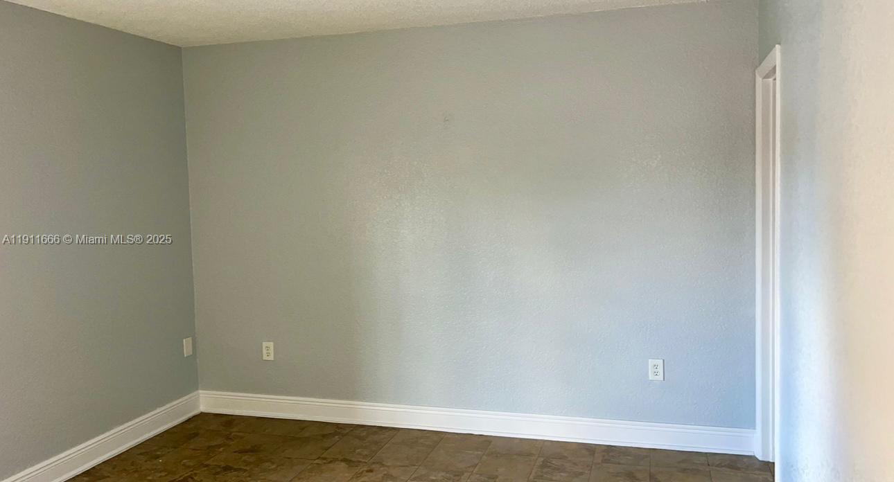 575 West 69th Street, Unit 208 Hialeah, FL 33014 - Photo 6 of 10 a view of an empty room