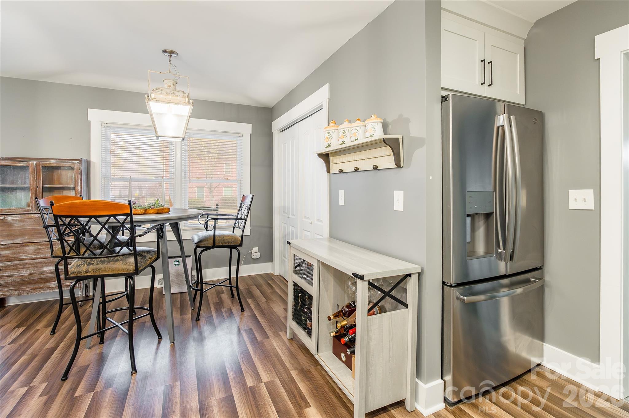 245 Mellon Road Belmont, NC 28012 - Photo 11 of 30 a dining area with furniture window and wooden floor