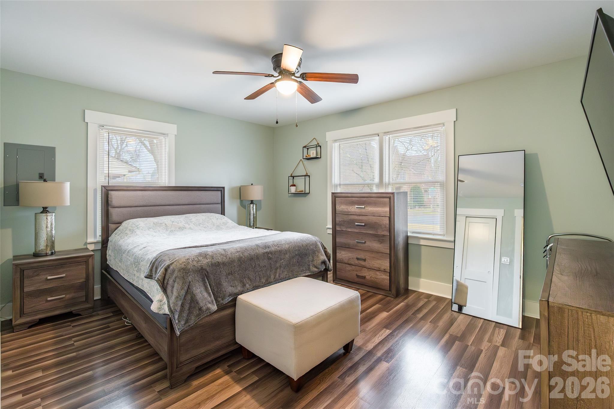 245 Mellon Road Belmont, NC 28012 - Photo 12 of 30 a bedroom with a bed and wooden floor