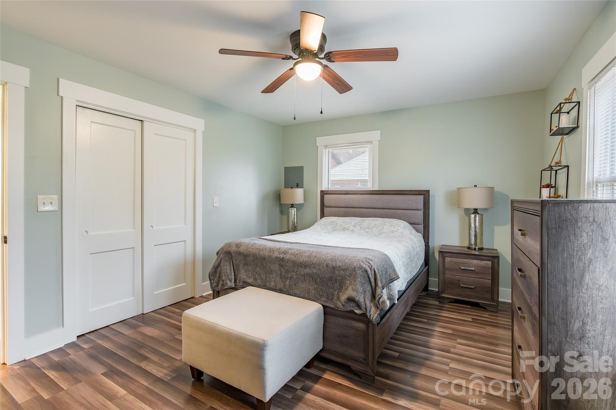 245 Mellon Road Belmont, NC 28012 - Photo 13 of 30 a bedroom with a bed and a chandelier