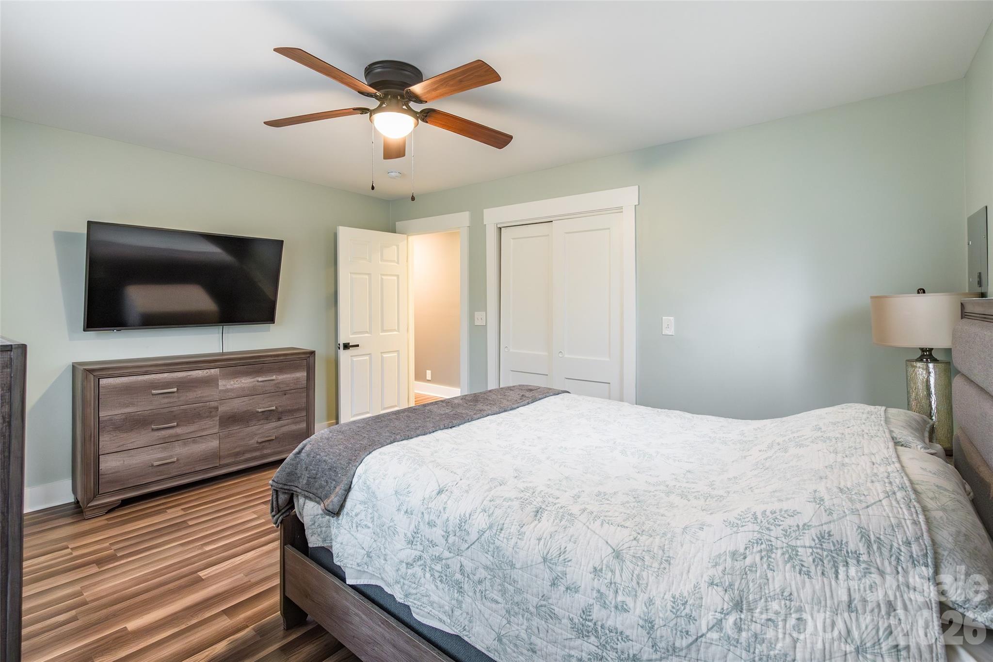245 Mellon Road Belmont, NC 28012 - Photo 14 of 30 a bedroom with a bed and a flat screen tv