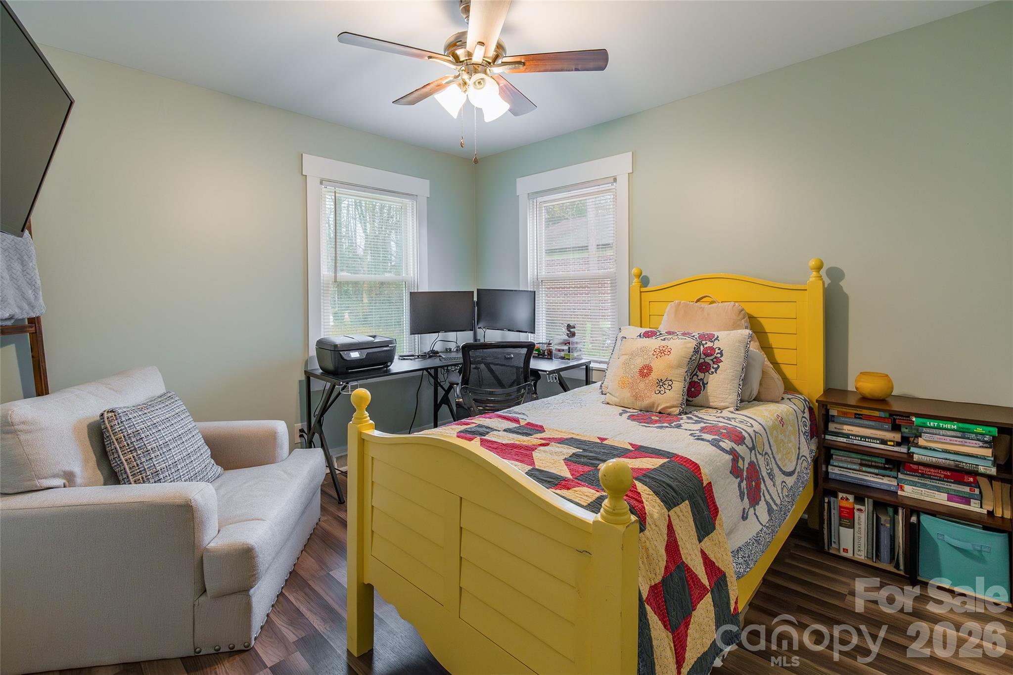 245 Mellon Road Belmont, NC 28012 - Photo 15 of 30 a bedroom with a bed and wooden floor