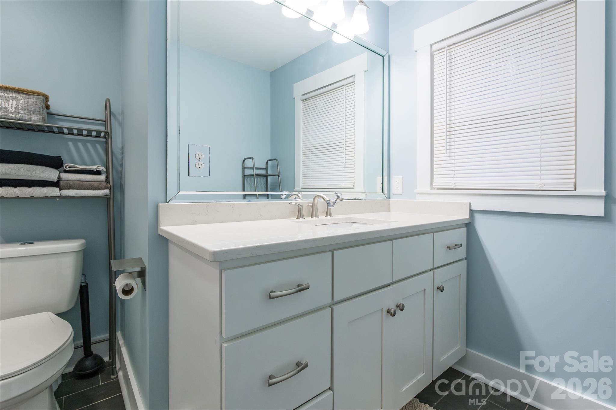 245 Mellon Road Belmont, NC 28012 - Photo 18 of 30 a bathroom with a sink toilet and window