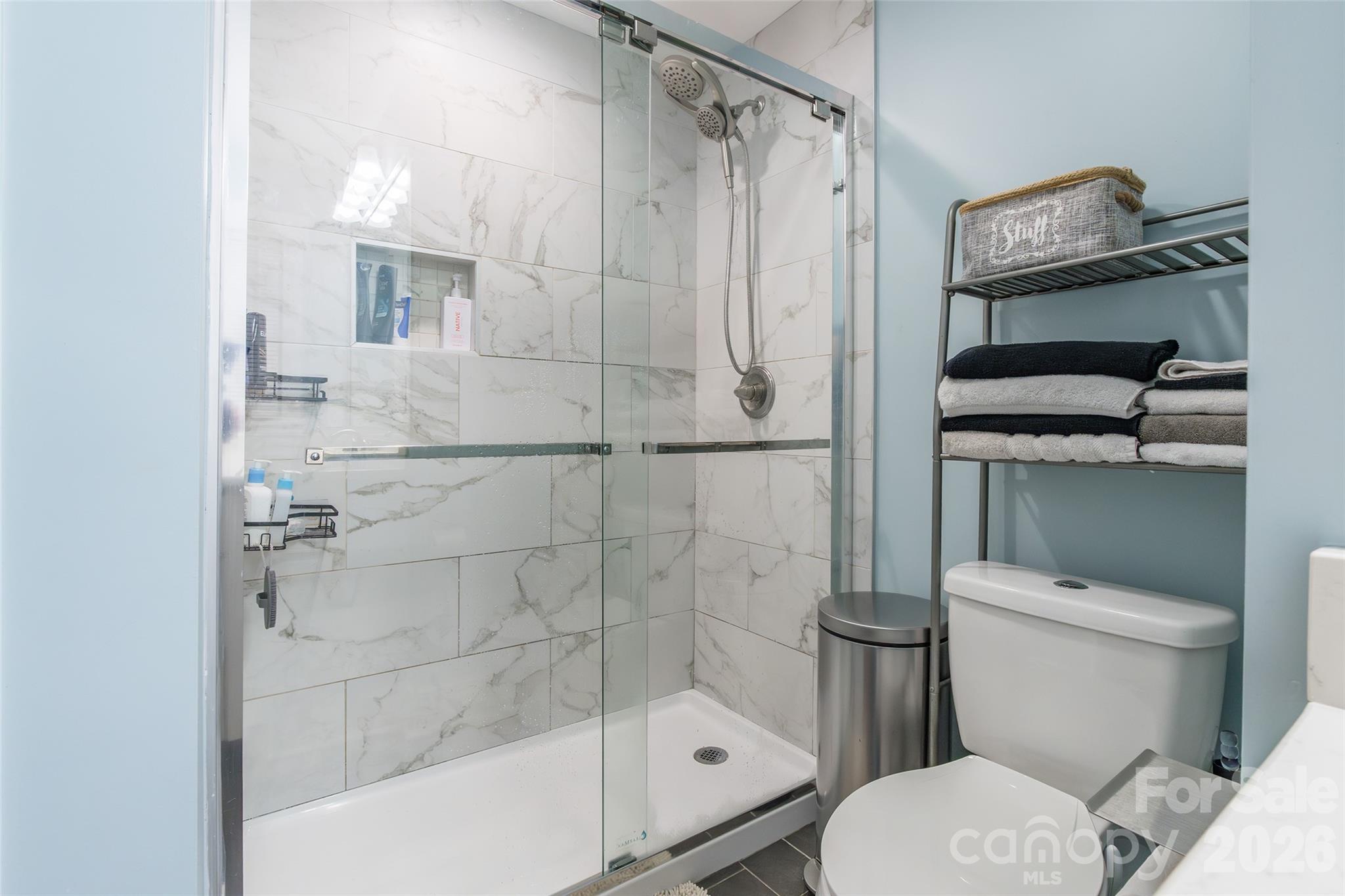245 Mellon Road Belmont, NC 28012 - Photo 19 of 30 a bathroom with a toilet and a shower