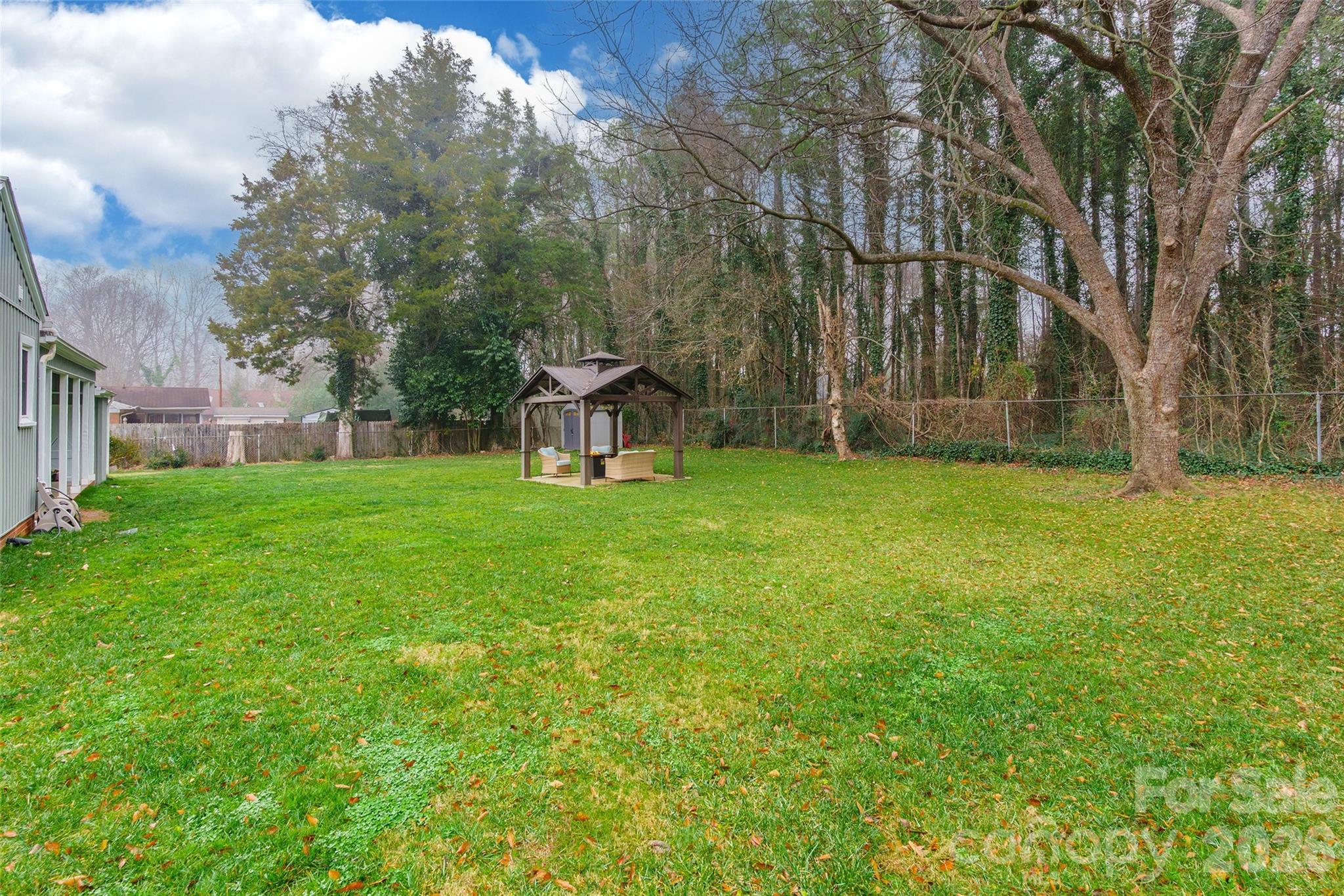 245 Mellon Road Belmont, NC 28012 - Photo 25 of 30 a view of a house with a yard and sitting area