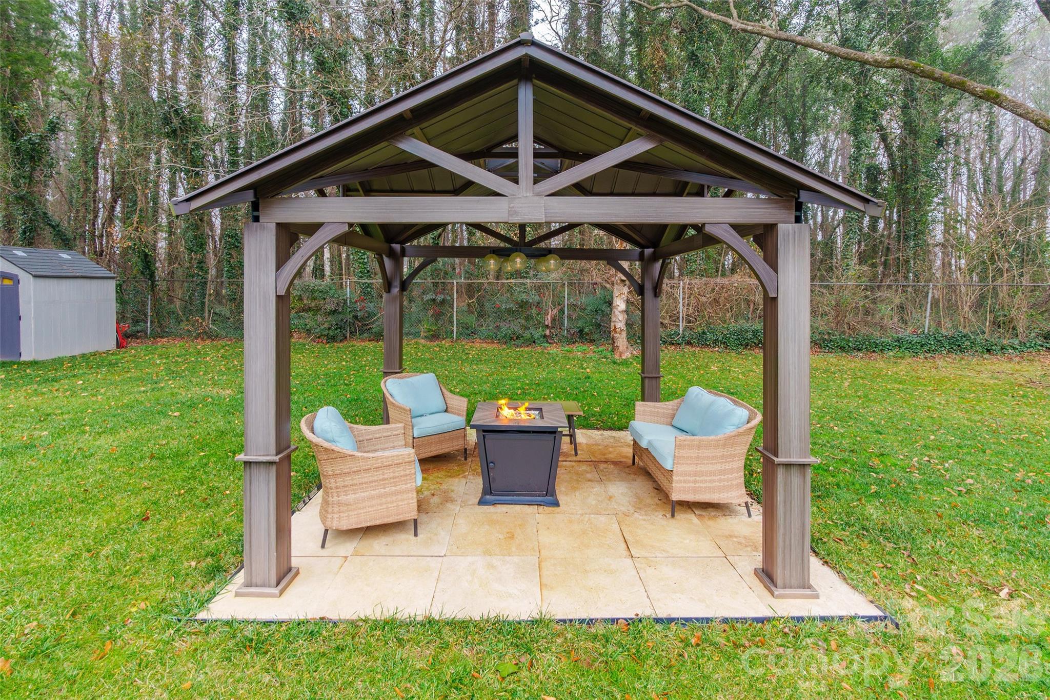245 Mellon Road Belmont, NC 28012 - Photo 28 of 30 a patio with a yard table and chairs