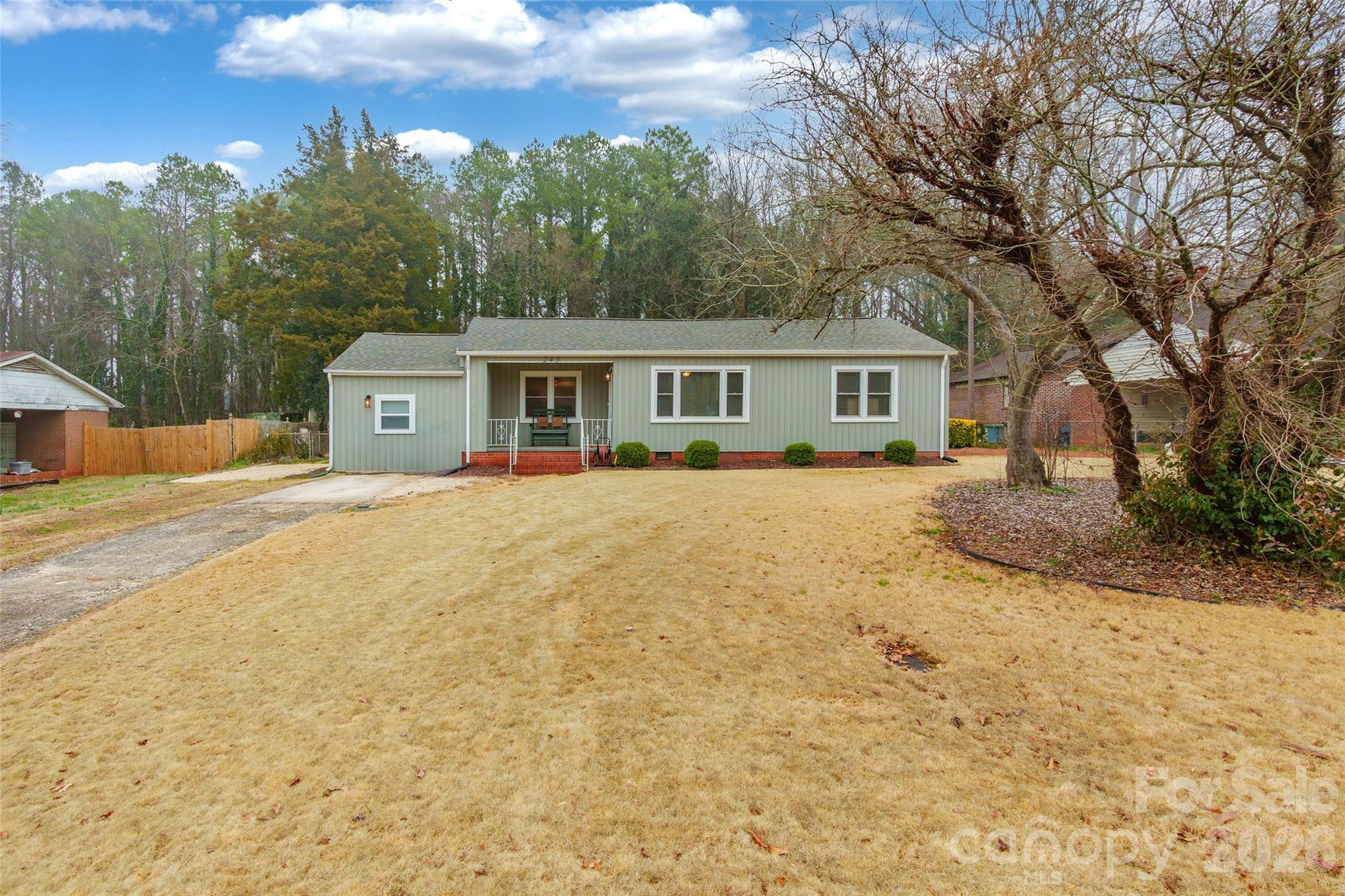 245 Mellon Road Belmont, NC 28012 - Photo 30 of 30 a front view of a house with a yard covered in snow