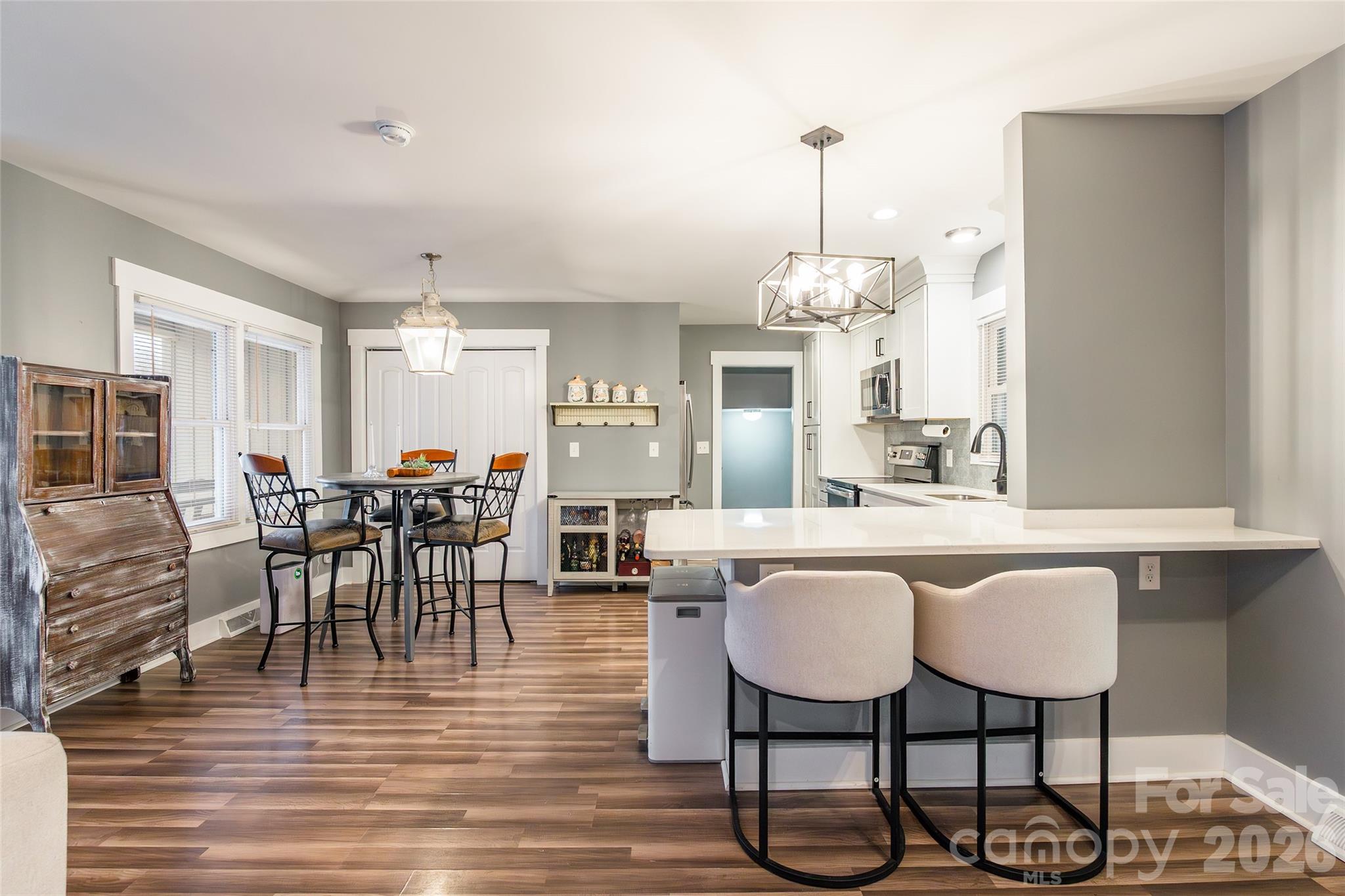 245 Mellon Road Belmont, NC 28012 - Photo 7 of 30 a view of a dining room with furniture and wooden floor