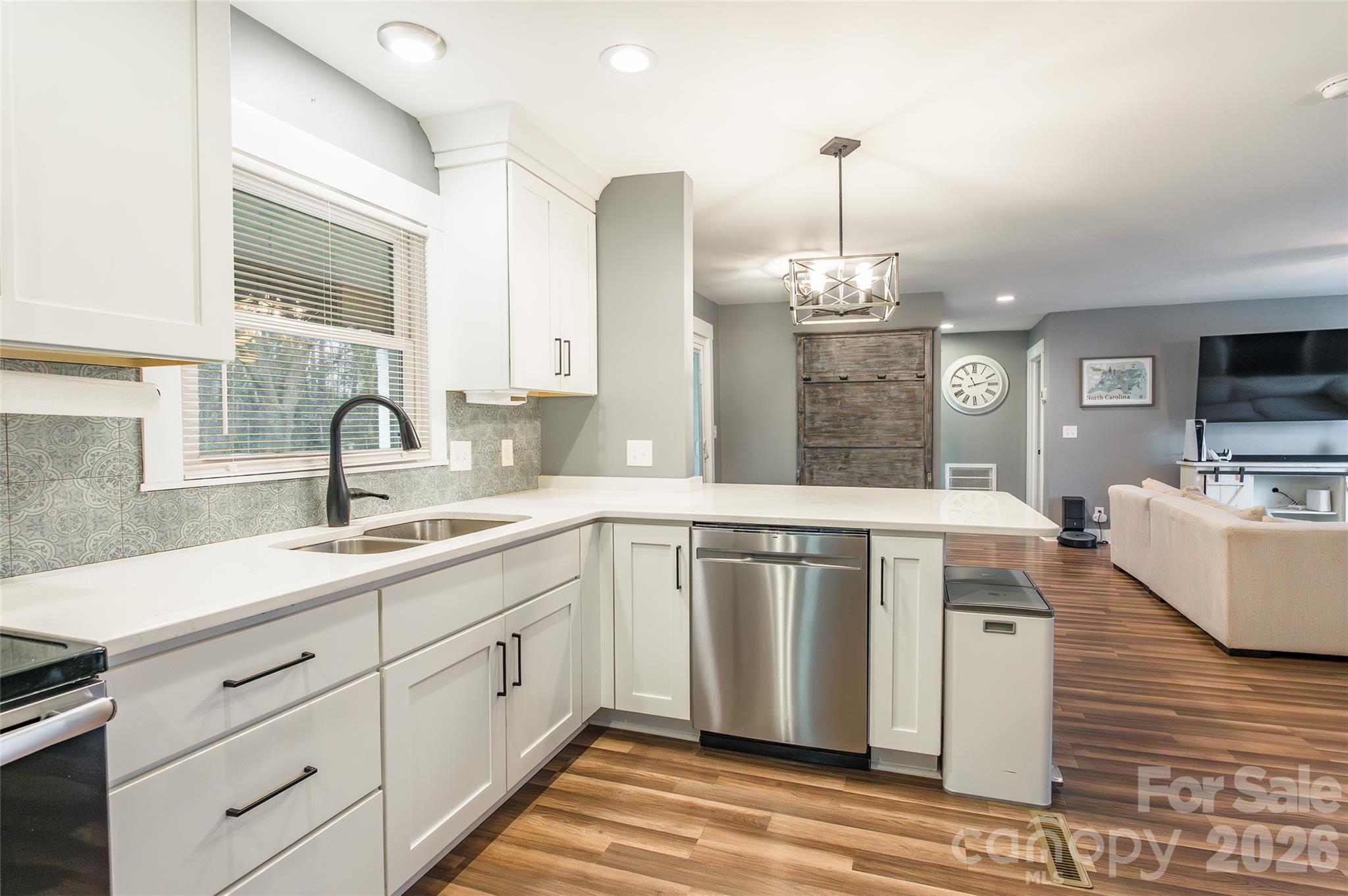 245 Mellon Road Belmont, NC 28012 - Photo 10 of 30 a kitchen with stainless steel appliances granite countertop a sink stove and refrigerator