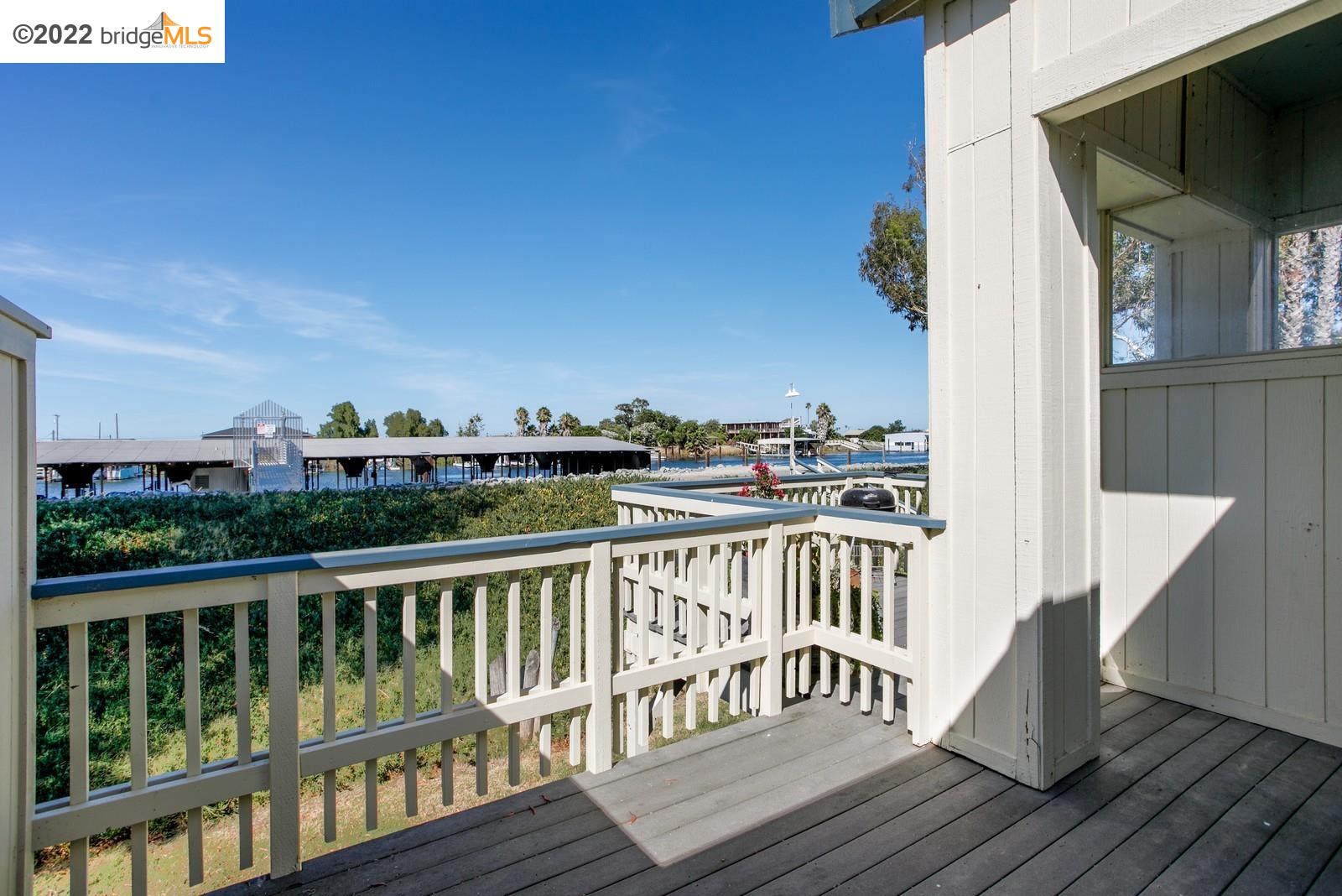 3451 Wells Road Oakley, CA 94561 - Photo 1 of 1 a view of a balcony with two chairs and wooden floor