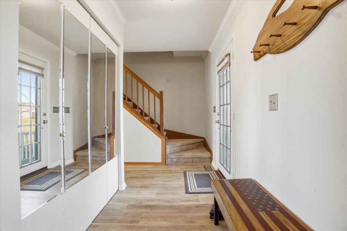 3413 Harbor Ridge Drive Zion, IL 60099 - Photo 7 of 37 a view of front door with wooden floor and stairs