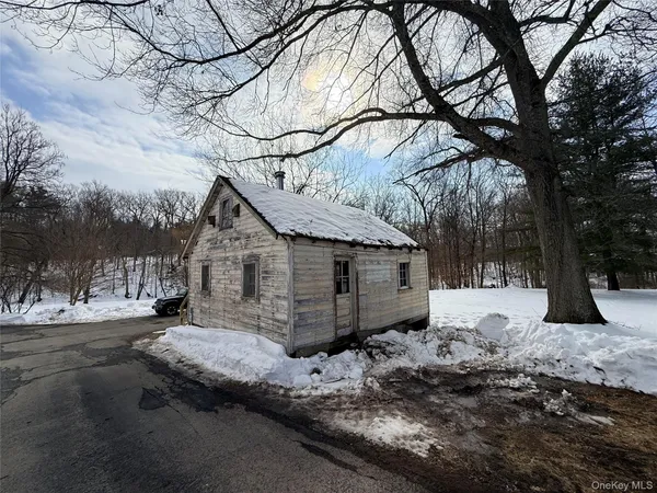 a view of a yard covered in snow