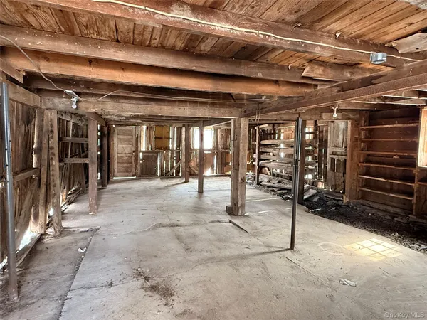 a view of an empty room with wooden roof
