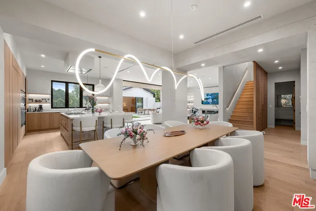 a dining room with a table and chairs