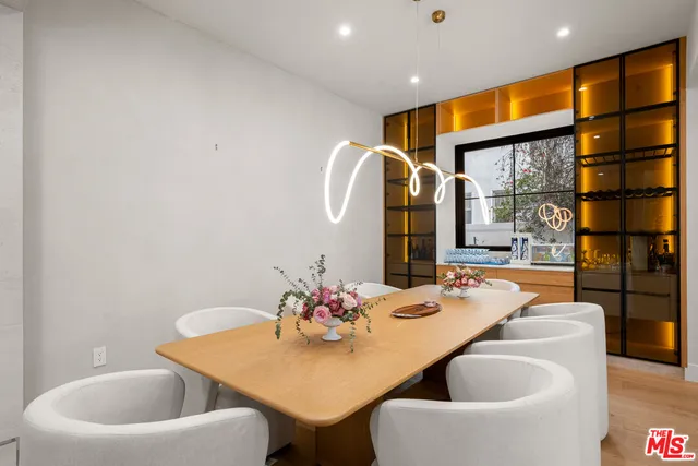 a living room with furniture a fireplace and a garden