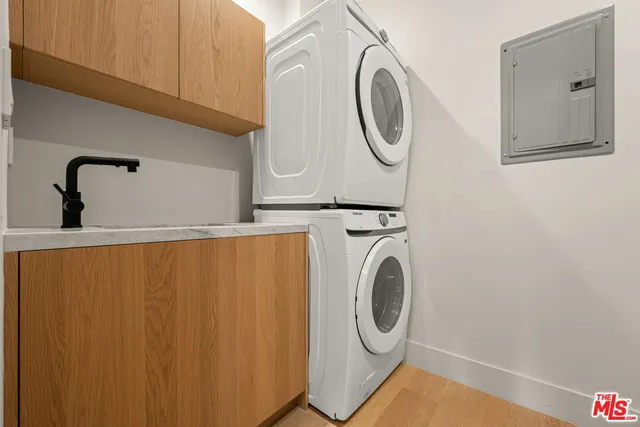 a view of a livingroom with a ceiling fan and window