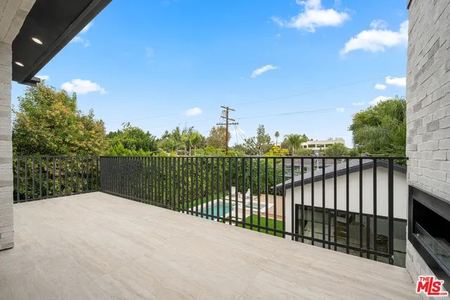 a bedroom with a large bed and a large window
