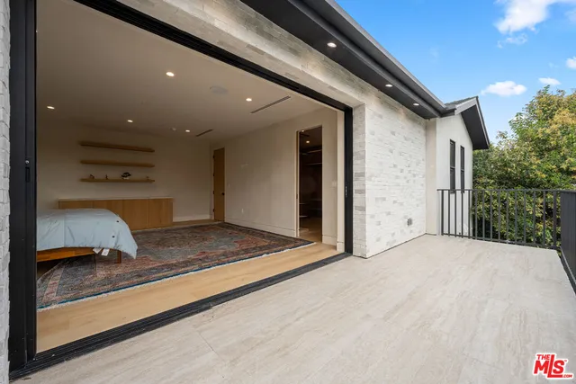 a large bathroom with a double vanity sink a mirror and a bathtub