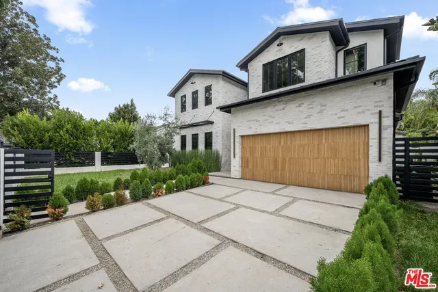 a view of house with swimming pool outdoor seating