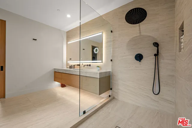 a patio with table and chairs and a big yard