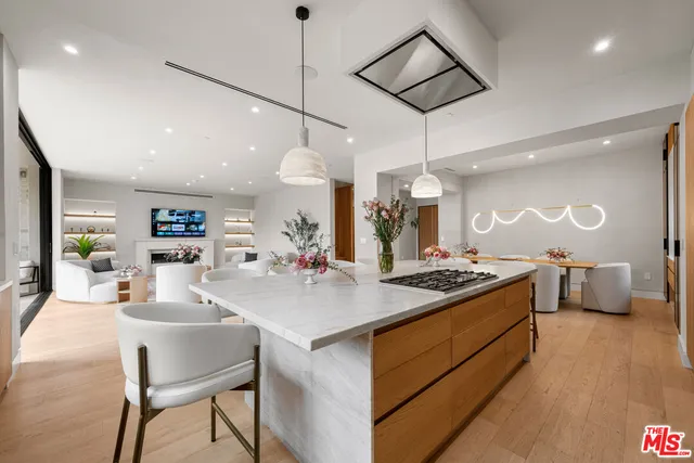 a living room with furniture a flat screen tv and a large window