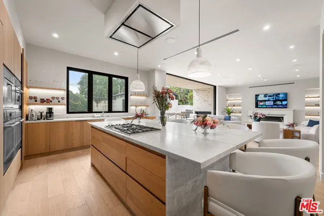 a bathroom with a sink a mirror and a window