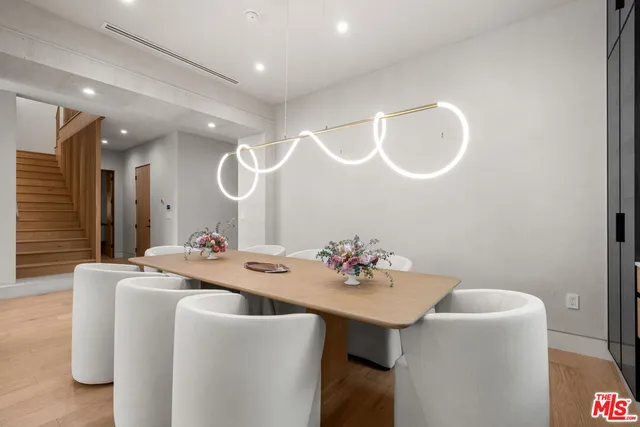 a view of a dining room with furniture and window