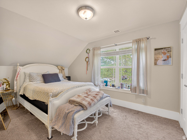 557 Craftsman Way Midway, UT 84049 - Photo 41 of 59 Attic room featuring a window, sloped ceilings, and carpet flooring