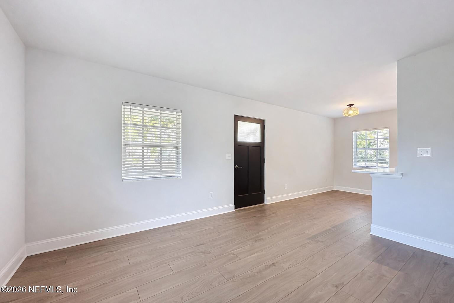 5128 Sunderland Road Jacksonville, FL 32210 - Photo 9 of 32 Empty Living/Dining Room