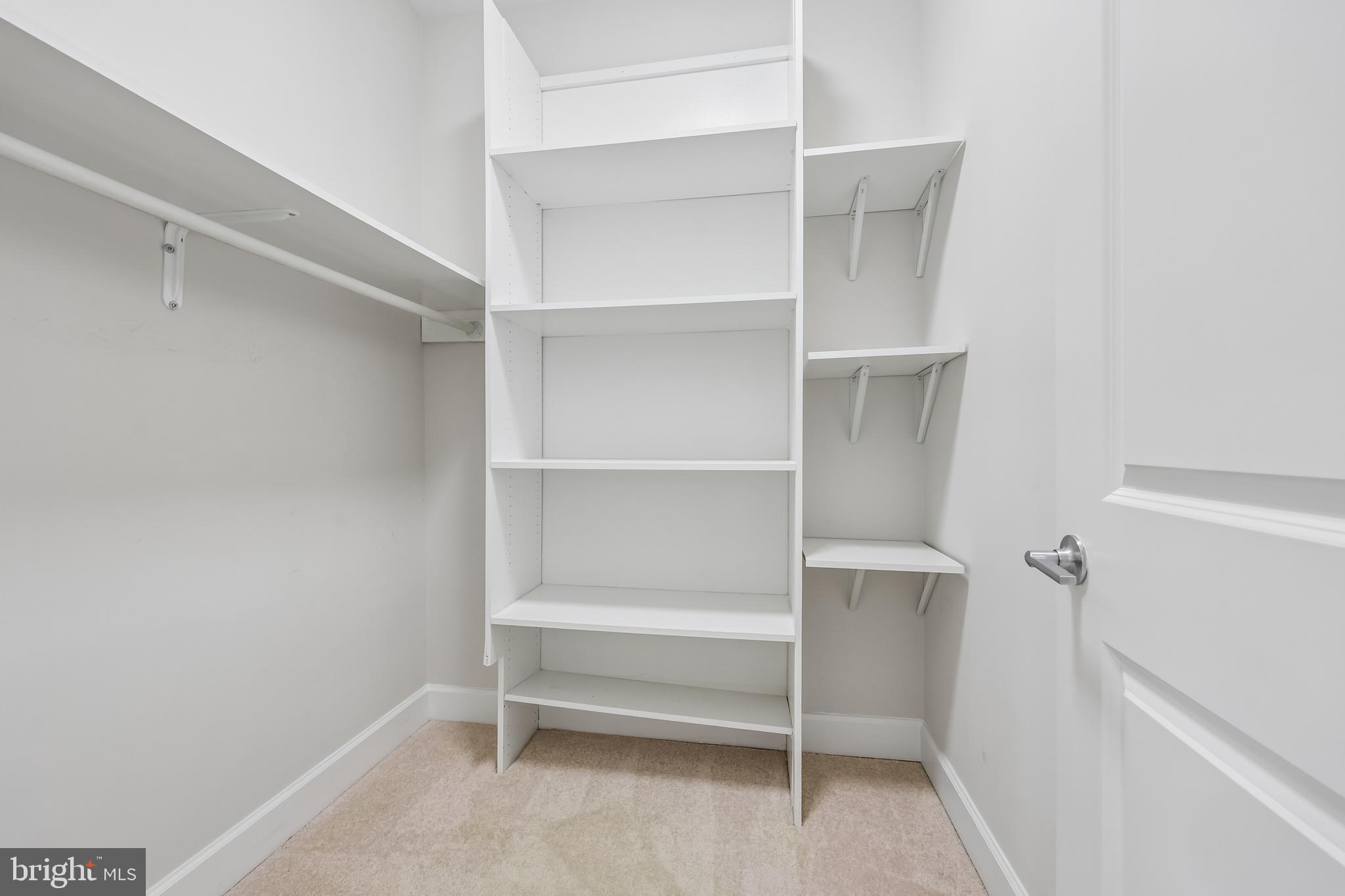 12304 Popes Head Road Fairfax, VA 22030 - Photo 44 of 78 a view of walk in closet with empty racks