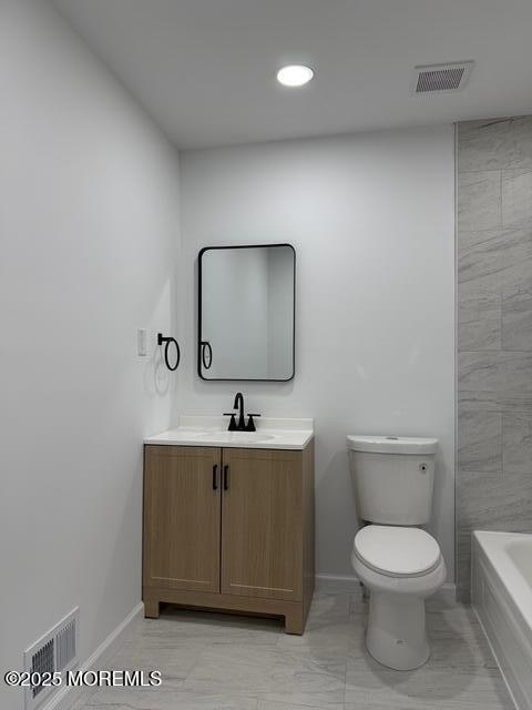 23 Primrose Lane Brick, NJ 08724 - Photo 15 of 22 a bathroom with a toilet a sink and mirror