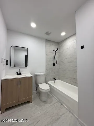 a bathroom with a shower and a toilet