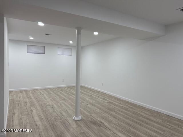 23 Primrose Lane Brick, NJ 08724 - Photo 20 of 22 a view of an empty room with wooden floor
