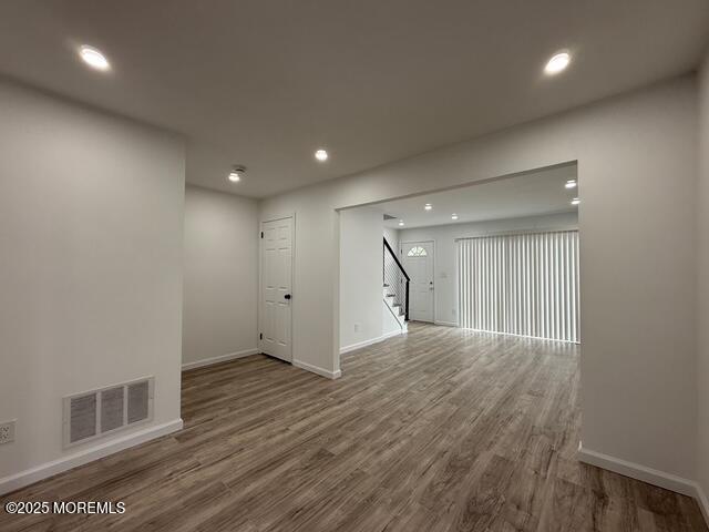 23 Primrose Lane Brick, NJ 08724 - Photo 6 of 22 an empty room with wooden floor and windows