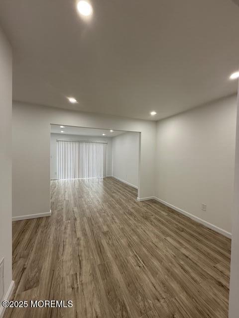 23 Primrose Lane Brick, NJ 08724 - Photo 7 of 22 an empty room with wooden floor and windows