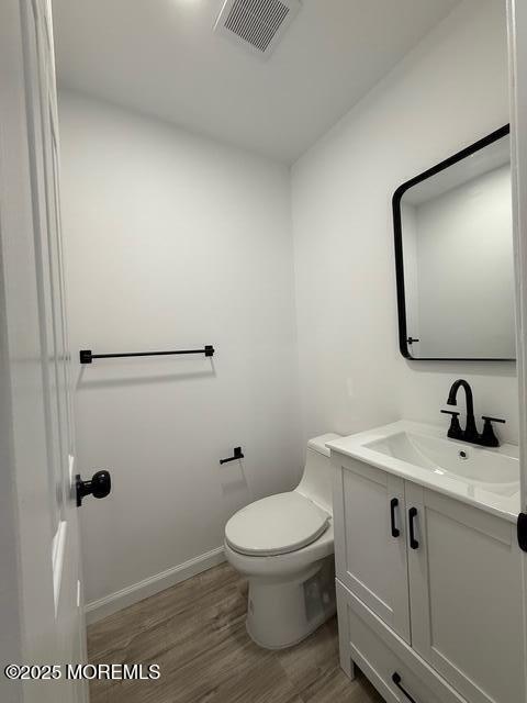 23 Primrose Lane Brick, NJ 08724 - Photo 10 of 22 a bathroom with a toilet a sink and mirror