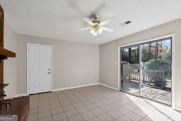 a view of an empty room and window