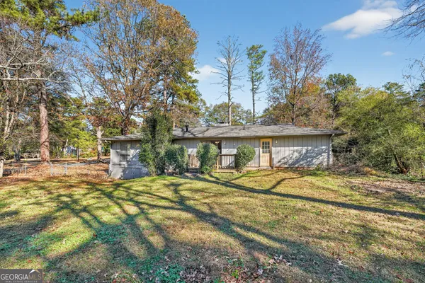 a view of a house with basketball court