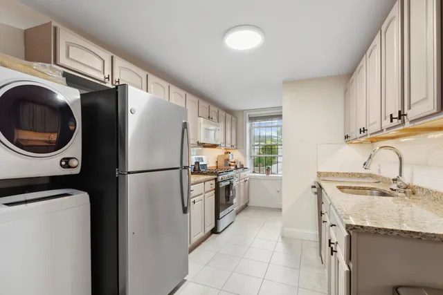 a view of room with window ceiling fan and hardwood floor
