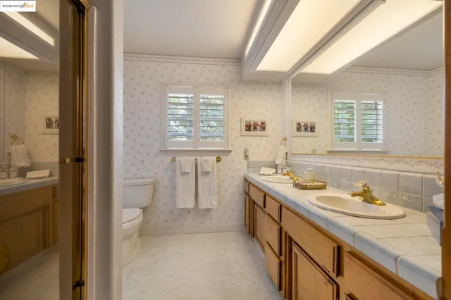 a bathroom with a sink toilet and vanity