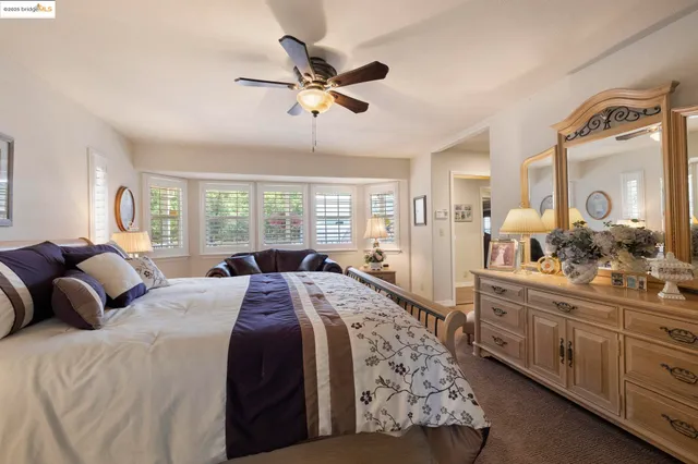 a bed room with a bed and a chandelier