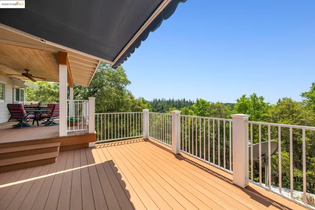 a view of a balcony with wooden floor
