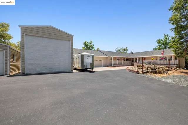 a view of a house with a street