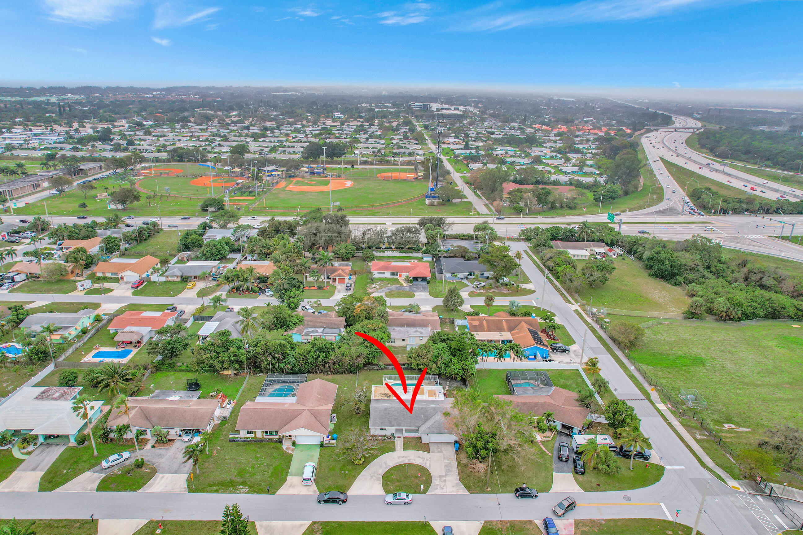 334 Southwest 13th Avenue Boynton Beach, FL 33435 - Photo 1 of 41 an aerial view of residential houses with outdoor space