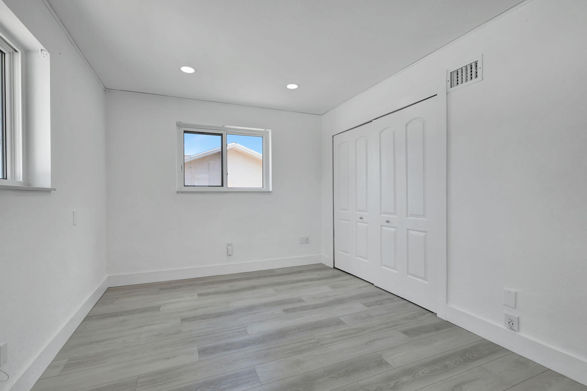 334 Southwest 13th Avenue Boynton Beach, FL 33435 - Photo 22 of 41 wooden floor in an empty room with a window